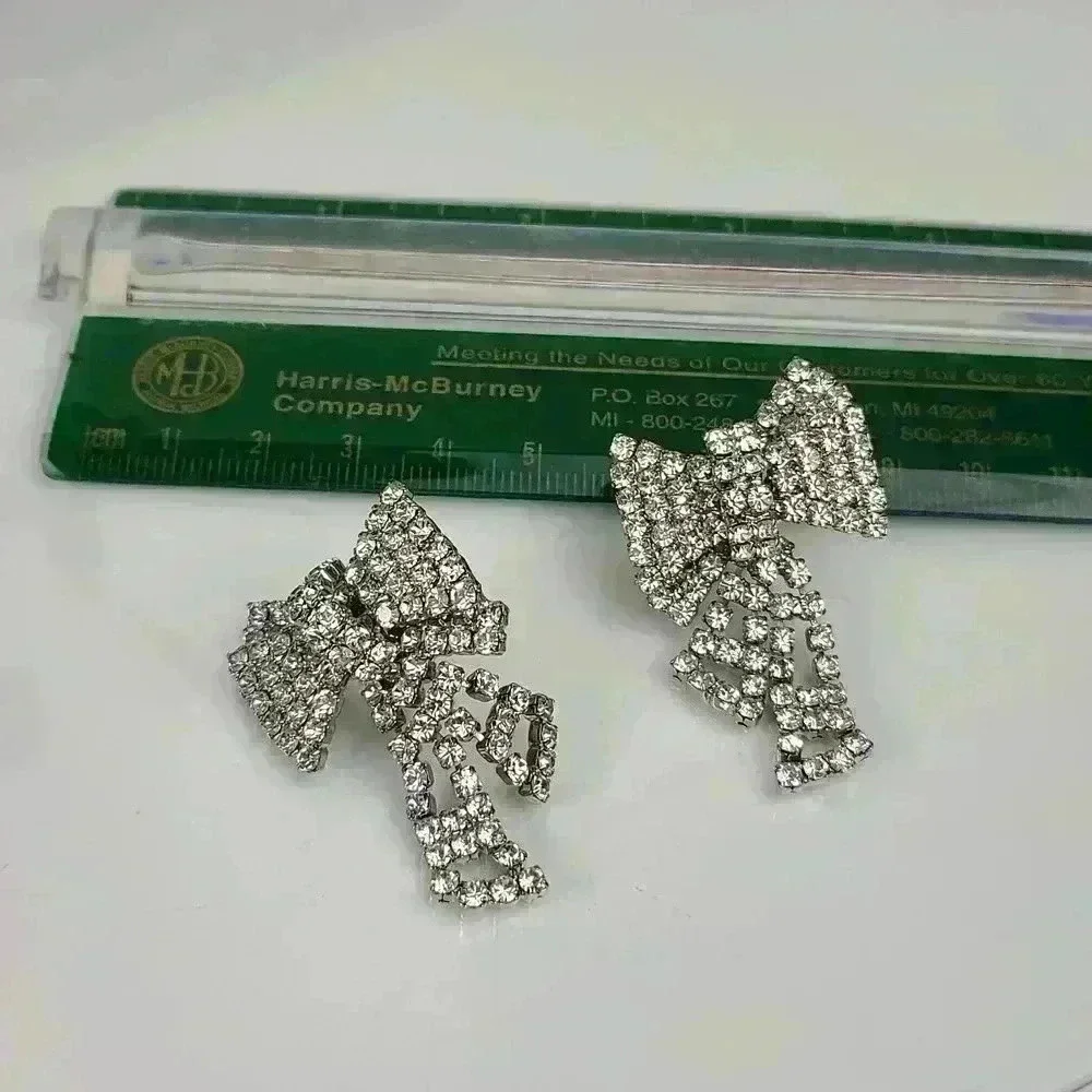 Silver tone clear rhinestones bow earrings - Picture 3 of 17